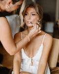 Jayda K applying bridal makeup on a wedding morning